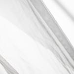 Delicate sheer fabric in black and white, creating an abstract flowing pattern.